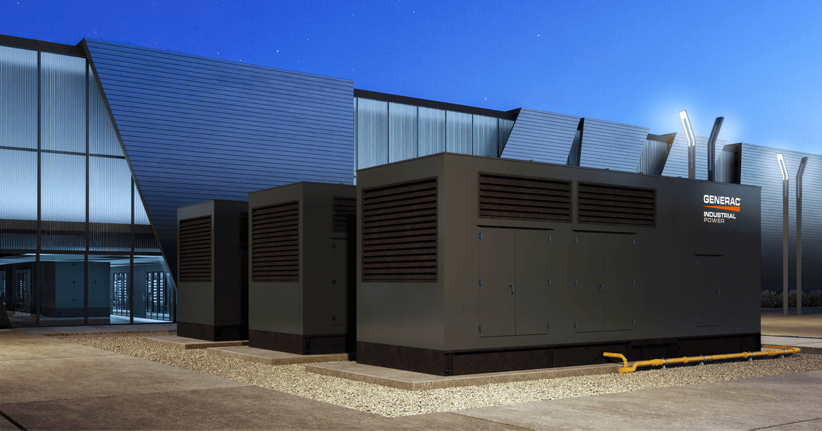 Group in Generac Industrial Power generators outside of large corporate building.